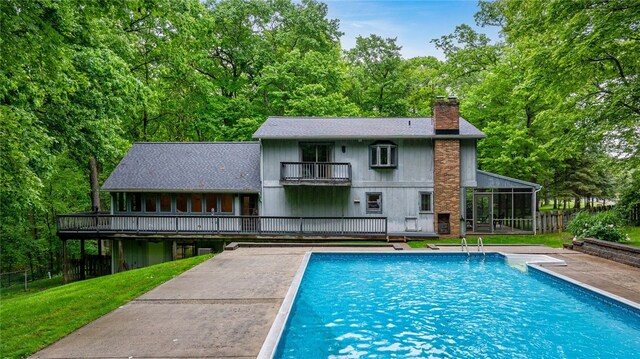 124 Oak Ln, Adams Twp, PA 16046 - view of swimming pool with a sunroom and a patio area