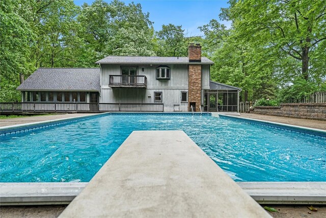 124 Oak Ln, Adams Twp, PA 16046 - view of pool featuring a sunroom and view of scattered trees