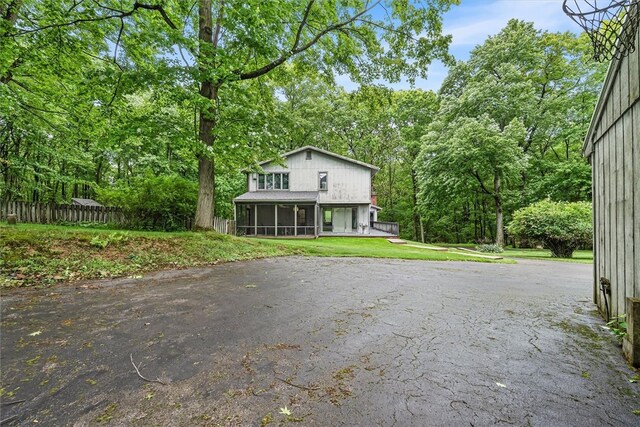 124 Oak Ln, Adams Twp, PA 16046 - view of front facade featuring a sunroom and driveway
