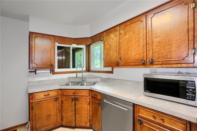 3473 Old Pulaski Rd, Wilmington Twp, PA 16105 - kitchen featuring stainless steel appliances, light countertops, and brown cabinetry