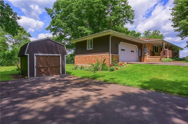 3473 Old Pulaski Rd, Wilmington Twp, PA 16105 - view of front of house with brick siding, a shed, a front yard, and a garage