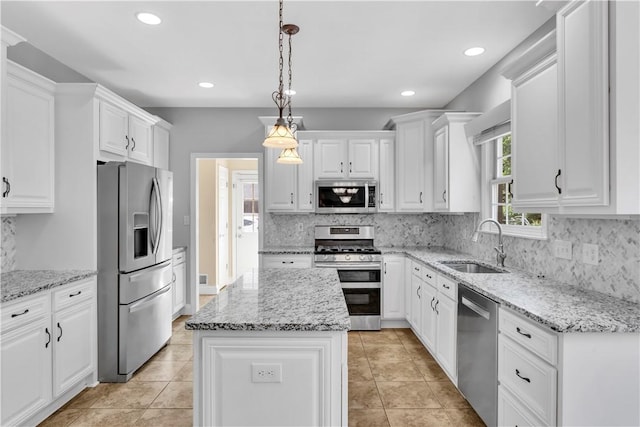360 Steeplechase Dr, Cranberry Twp, PA 16066 - kitchen featuring stainless steel appliances, white cabinetry, a kitchen island, backsplash, and recessed lighting