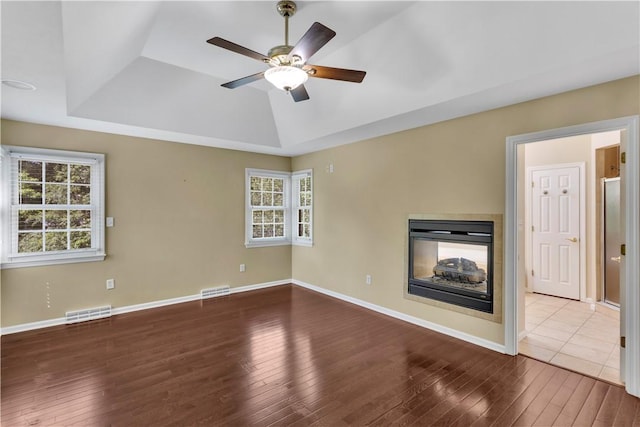360 Steeplechase Dr, Cranberry Twp, PA 16066 - unfurnished living room featuring hardwood / wood-style floors, a raised ceiling, a multi sided fireplace, and ceiling fan