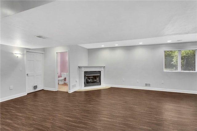 360 Steeplechase Dr, Cranberry Twp, PA 16066 - unfurnished living room featuring dark wood finished floors, a fireplace with raised hearth, and recessed lighting