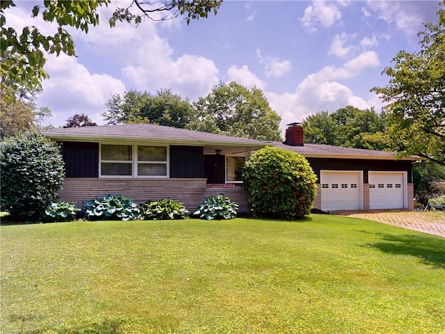 306 Cherokee Dr, Center Twp But, PA 16001 - single story home featuring an attached garage, a front lawn, a chimney, and driveway