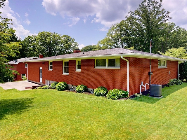 306 Cherokee Dr, Center Twp But, PA 16001 - view of property exterior featuring a chimney, a yard, and brick siding