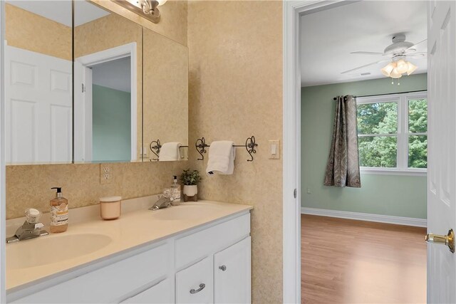 130 Sewickley Farm Cir, Marshall, PA 16046 - bathroom with double vanity, wood finished floors, and a ceiling fan