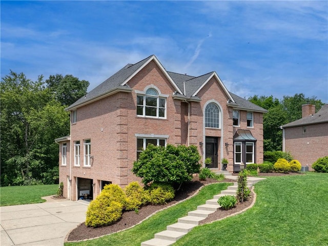 130 Sewickley Farm Cir, Marshall, PA 16046 - view of front of home with an attached garage, brick siding, a front yard, and driveway