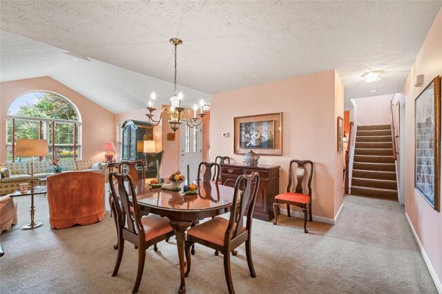6422 Jefferson Pointe Cir, Jefferson Hills, PA 15025 - dining room with carpet flooring, a textured ceiling, a chandelier, stairs, and vaulted ceiling