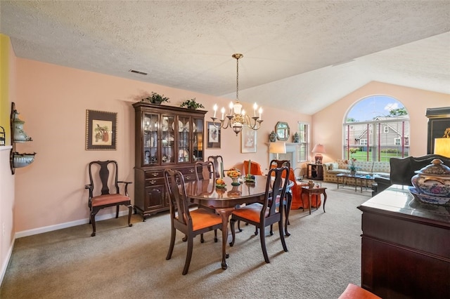6422 Jefferson Pointe Cir, Jefferson Hills, PA 15025 - dining space featuring a chandelier, light carpet, lofted ceiling, and a textured ceiling