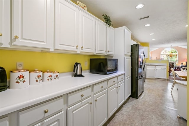 6422 Jefferson Pointe Cir, Jefferson Hills, PA 15025 - kitchen with black appliances, white cabinetry, light countertops, recessed lighting, and a chandelier