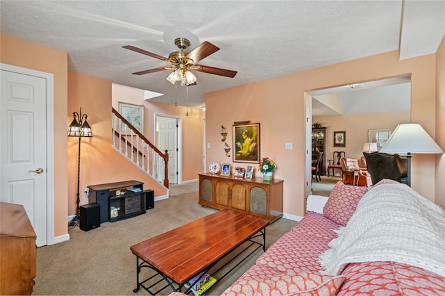 6422 Jefferson Pointe Cir, Jefferson Hills, PA 15025 - living room with carpet flooring, stairs, ceiling fan, and a textured ceiling