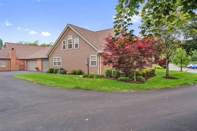 6422 Jefferson Pointe Cir, Jefferson Hills, PA 15025 - view of front facade with an attached garage, driveway, a front lawn, and brick siding