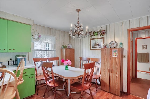 1059 Old Princeton Rd, Shenango Twp Law, PA 16101 - dining area with a chandelier, wood finished floors, and wooden walls
