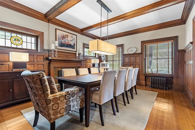 6909 Meade St, Point Breeze, PA 15208 - dining area featuring radiator heating unit, light wood-style flooring, crown molding, beamed ceiling, and coffered ceiling
