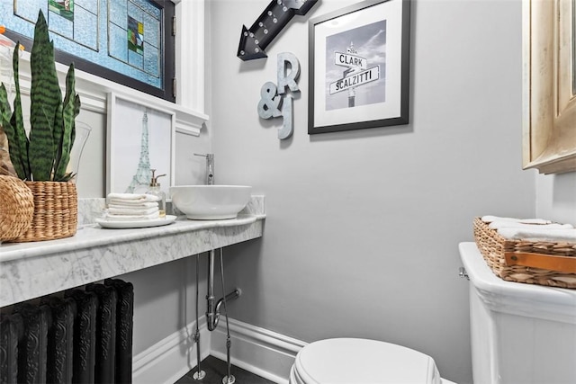 6909 Meade St, Point Breeze, PA 15208 - half bathroom featuring toilet and baseboards