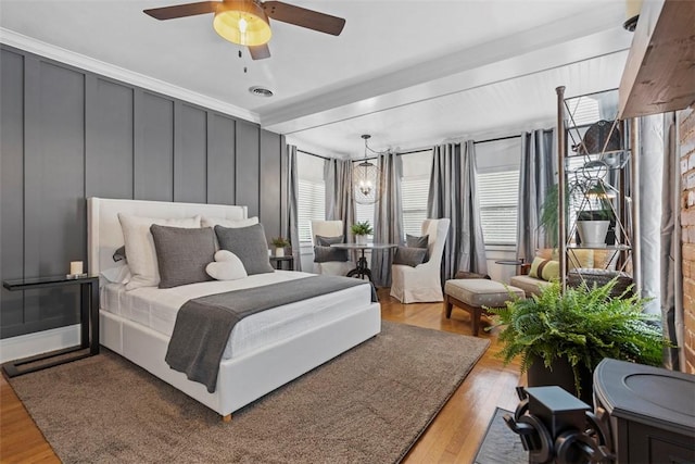 6909 Meade St, Point Breeze, PA 15208 - bedroom with wood finished floors and a decorative wall