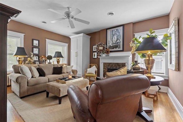 6909 Meade St, Point Breeze, PA 15208 - living room with a high end fireplace, hardwood / wood-style floors, and ceiling fan