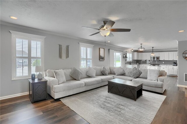 112 Norfolk Dr, Buffalo Twp But, PA 16055 - living area featuring crown molding, a ceiling fan, dark wood-type flooring, and recessed lighting
