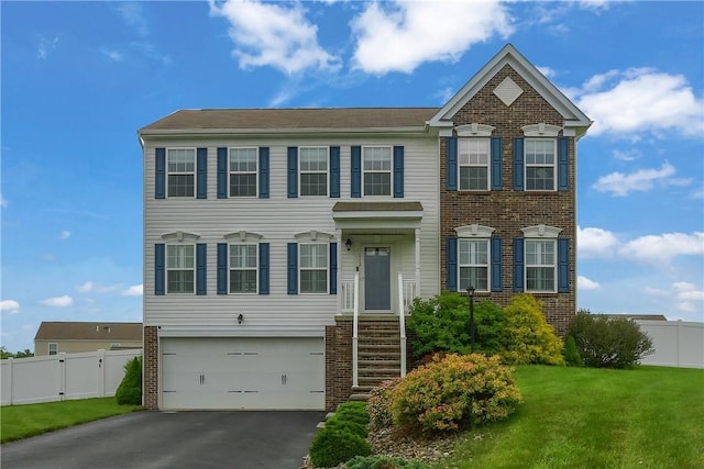 112 Norfolk Dr, Buffalo Twp But, PA 16055 - view of front of house featuring driveway, a garage, and brick siding