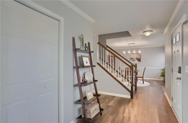 112 Norfolk Dr, Buffalo Twp But, PA 16055 - foyer entrance with stairs, crown molding, wood finished floors, and a chandelier