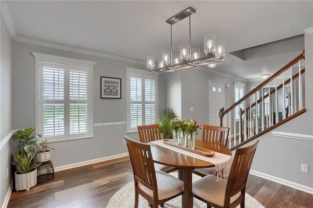 112 Norfolk Dr, Buffalo Twp But, PA 16055 - dining area with crown molding, a chandelier, wood finished floors, and stairway
