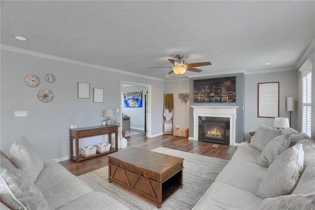 112 Norfolk Dr, Buffalo Twp But, PA 16055 - living area with wood finished floors, a glass covered fireplace, ceiling fan, crown molding, and recessed lighting