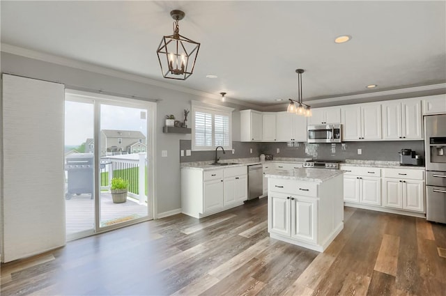 112 Norfolk Dr, Buffalo Twp But, PA 16055 - kitchen with stainless steel appliances, ornamental molding, dark wood finished floors, white cabinetry, and decorative light fixtures