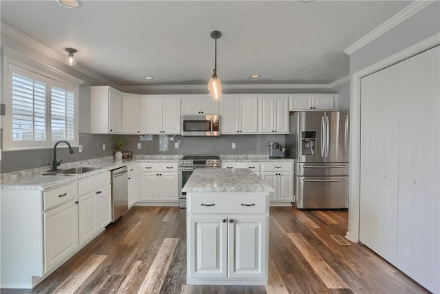 112 Norfolk Dr, Buffalo Twp But, PA 16055 - kitchen featuring appliances with stainless steel finishes, white cabinetry, dark wood-style floors, pendant lighting, and crown molding