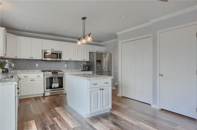 112 Norfolk Dr, Buffalo Twp But, PA 16055 - kitchen featuring stainless steel appliances, light wood-type flooring, crown molding, white cabinets, and pendant lighting