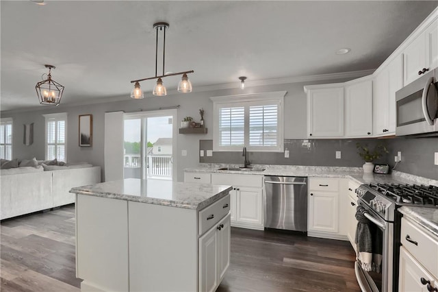 112 Norfolk Dr, Buffalo Twp But, PA 16055 - kitchen with appliances with stainless steel finishes, healthy amount of natural light, crown molding, and dark wood-style floors