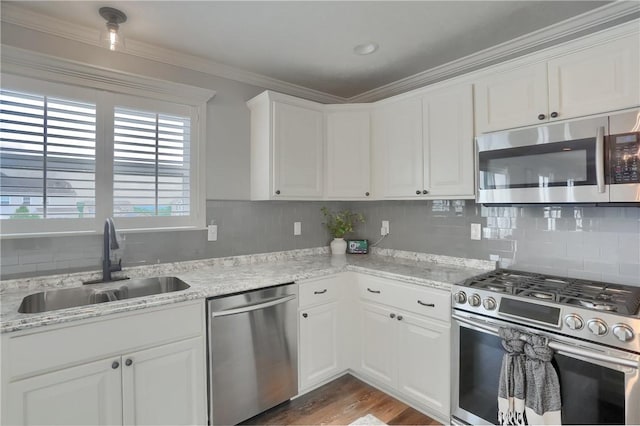 112 Norfolk Dr, Buffalo Twp But, PA 16055 - kitchen with stainless steel appliances, decorative backsplash, white cabinets, dark wood-style floors, and ornamental molding