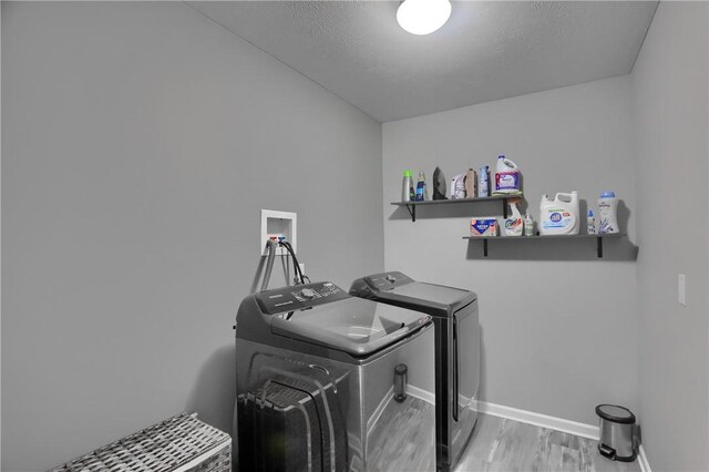 112 Norfolk Dr, Buffalo Twp But, PA 16055 - washroom with independent washer and dryer and wood finished floors