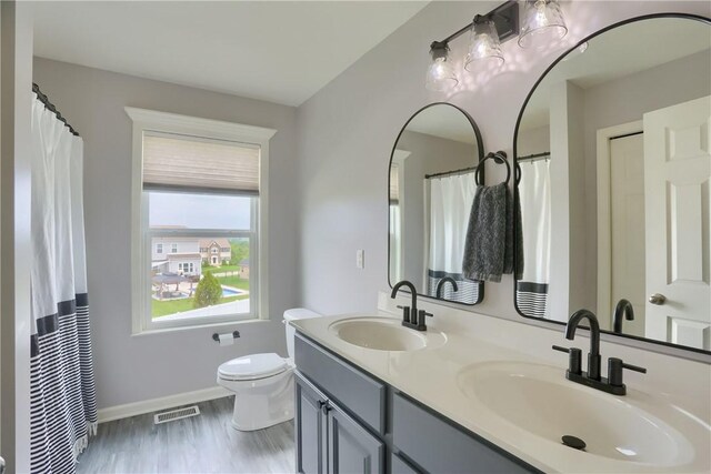 112 Norfolk Dr, Buffalo Twp But, PA 16055 - bathroom with double vanity and wood finished floors
