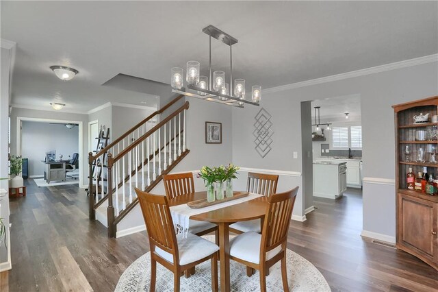 112 Norfolk Dr, Buffalo Twp But, PA 16055 - dining space featuring dark wood-style floors, crown molding, a chandelier, and stairway