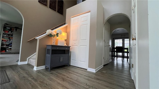 110 Mohawk Dr, Buffalo Twp But, PA 16055 - hall featuring arched walkways, dark wood-style floors, and stairs