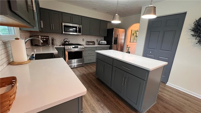 110 Mohawk Dr, Buffalo Twp But, PA 16055 - kitchen with stainless steel appliances, arched walkways, dark wood-type flooring, and tasteful backsplash