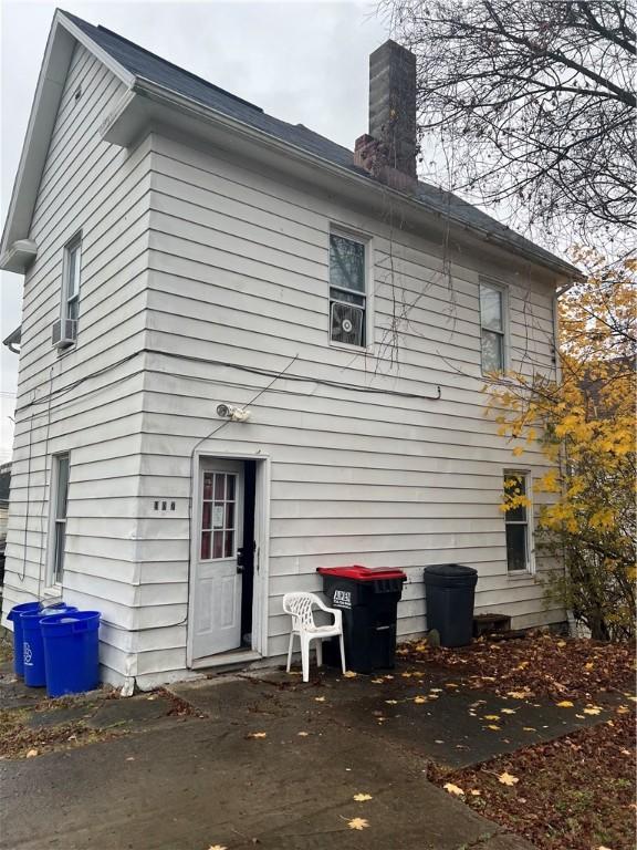 907 E Washington St, New Castle/4Th, PA 16101 - rear view of property featuring a chimney