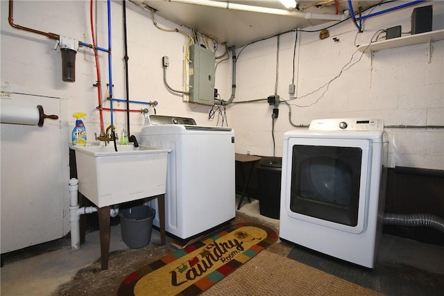794 Mercer Rd, Center Twp But, PA 16001 - laundry room featuring electric panel, washing machine and clothes dryer, and concrete block wall