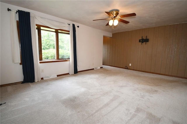 794 Mercer Rd, Center Twp But, PA 16001 - unfurnished room featuring a ceiling fan, light colored carpet, and wood walls