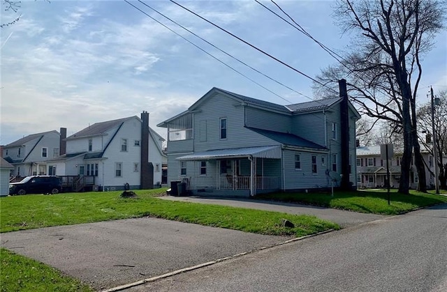 244 W Venango St, Mercer Boro Mer, PA 16137 - rear view of house with a chimney, a residential view, and a lawn