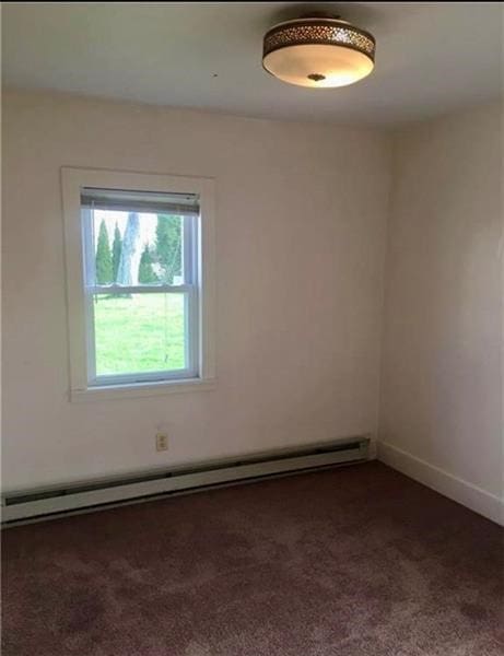 244 W Venango St, Mercer Boro Mer, PA 16137 - empty room with dark carpet and a baseboard radiator