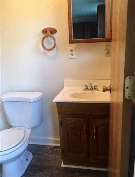 244 W Venango St, Mercer Boro Mer, PA 16137 - half bathroom featuring vanity and wood finished floors