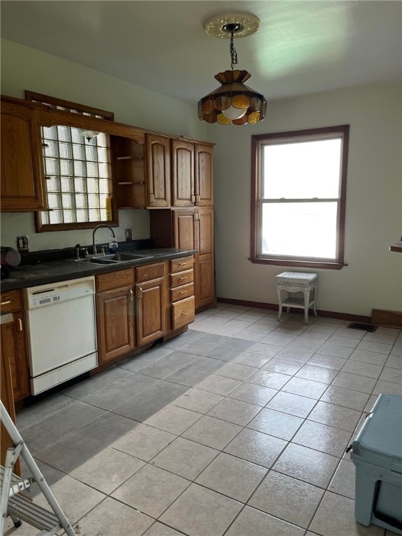 114 N Main St, Masontown, PA 15461 - kitchen featuring dishwasher, light tile patterned floors, dark countertops, open shelves, and brown cabinets