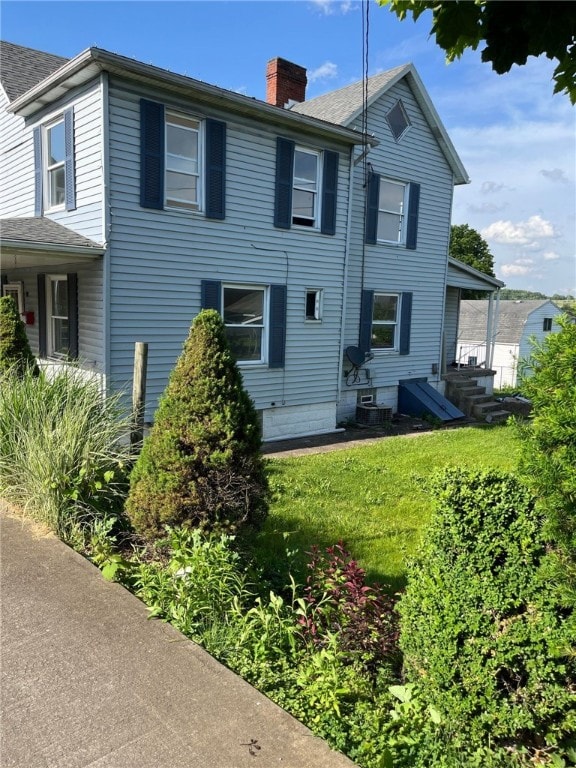 114 N Main St, Masontown, PA 15461 - rear view of house with a chimney