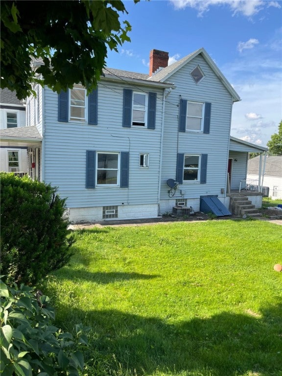 114 N Main St, Masontown, PA 15461 - rear view of property featuring a chimney and a lawn