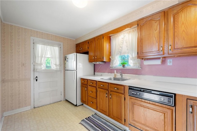 33 S Vireo Dr, Kennedy Twp, PA 15136 - kitchen with paneled dishwasher, freestanding refrigerator, wallpapered walls, light countertops, and light flooring