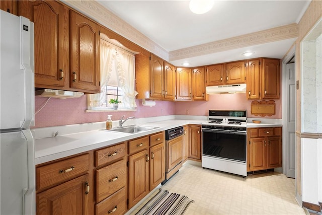 33 S Vireo Dr, Kennedy Twp, PA 15136 - kitchen with white appliances, under cabinet range hood, brown cabinets, and light countertops
