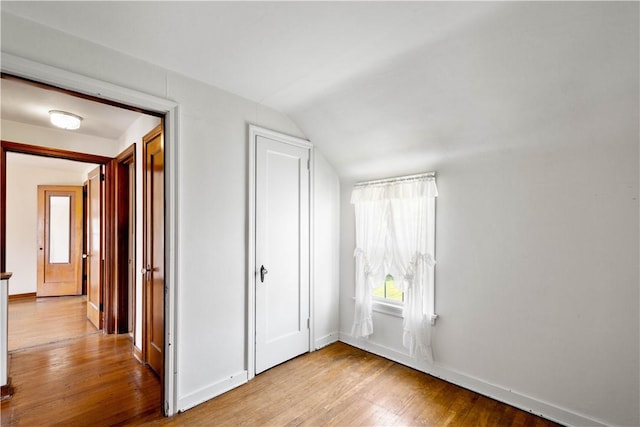 33 S Vireo Dr, Kennedy Twp, PA 15136 - unfurnished bedroom with vaulted ceiling, wood finished floors, and a closet