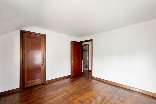 33 S Vireo Dr, Kennedy Twp, PA 15136 - spare room featuring dark wood finished floors and vaulted ceiling